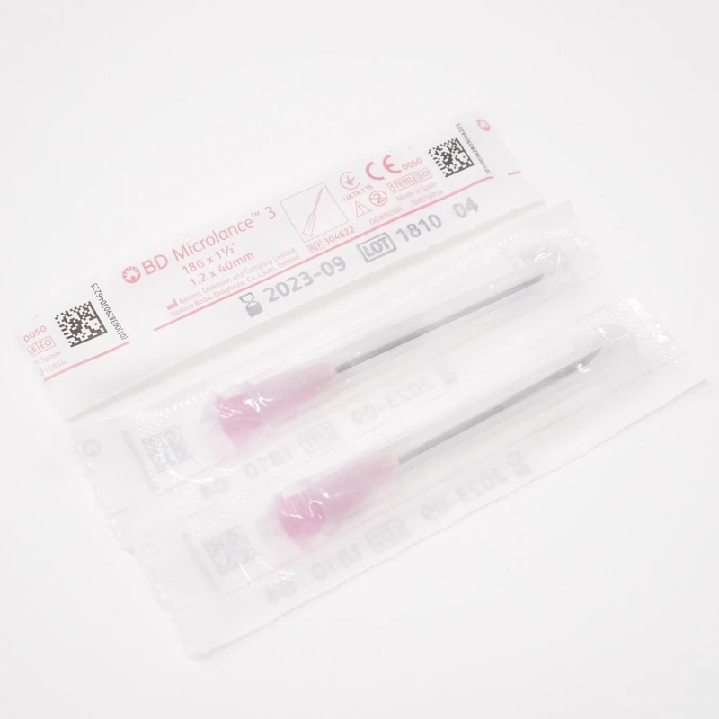 Two sterile 18 gauge 40mm needles with pink hubs in sealed packaging