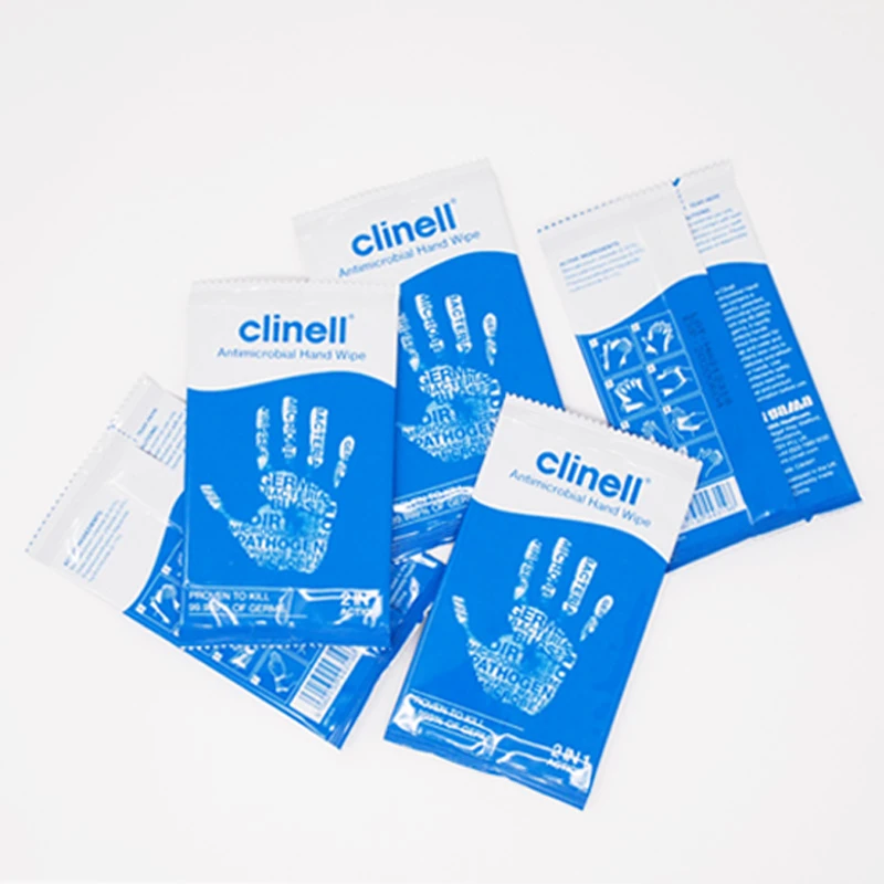 Several sealed blue Clinell antibacterial hand wipe sachets fanned out