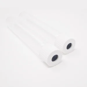 Two empty sterile glass vials lying on a white surface, each with a white ribbed cap and a dark rubber injection port