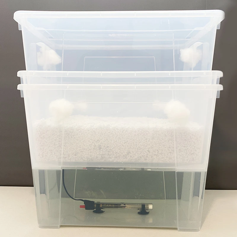 The CyLab: two clear stacked tubs, the lower holding water and a heater, the upper holding substrate