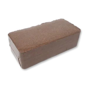 Coco coir brick: a compressed rectangular block of dark brown coconut fibre