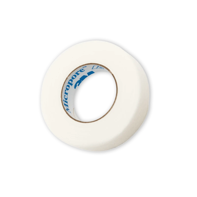 A roll of 3M Micropore breathable white paper tape on a black background