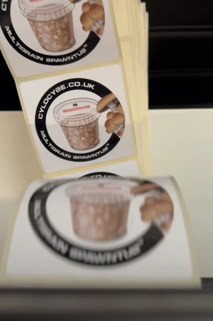 A roll of round Cylocybe.co.uk Multigrain SpawnTub labels